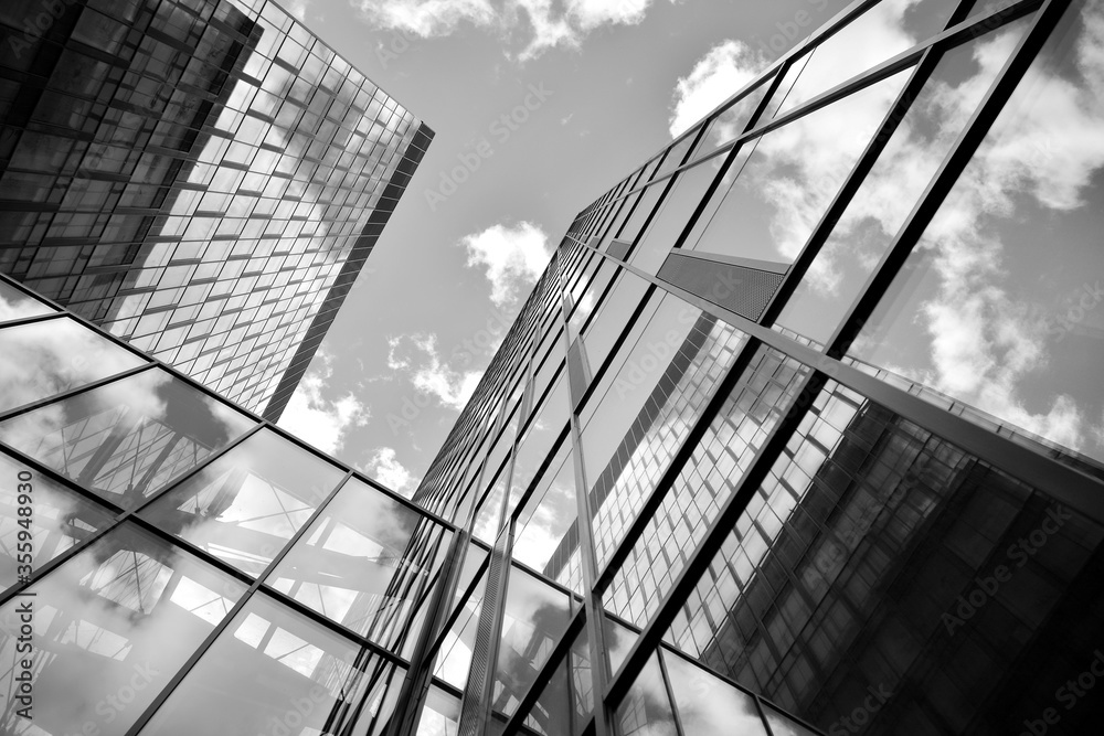 Urban geometry, looking up to glass building. Modern architecture, glass and steel. Abstract modern 