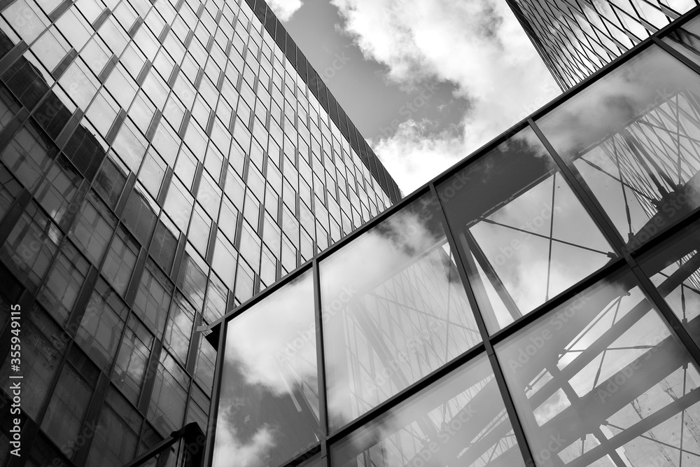 Urban geometry, looking up to glass building. Modern architecture, glass and steel. Abstract modern 