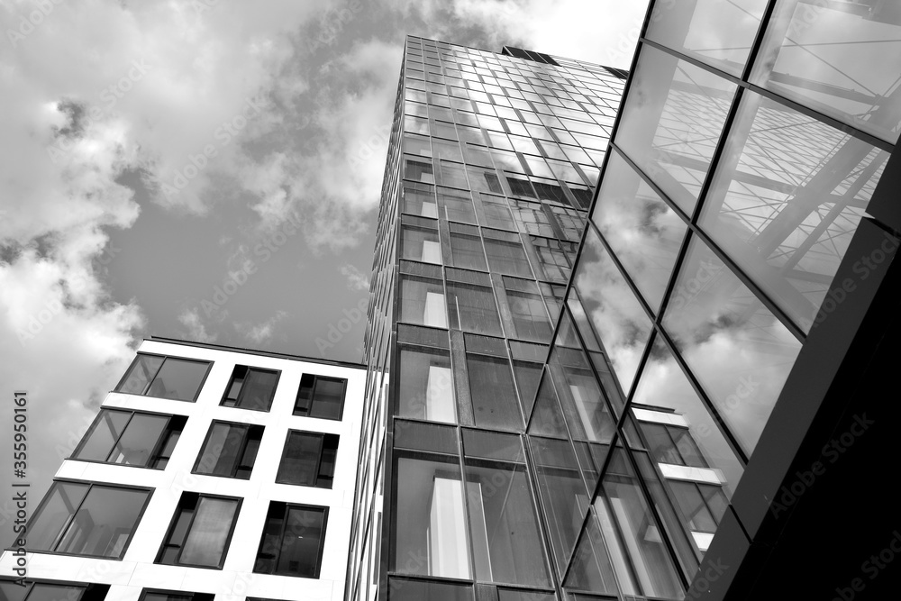 Urban geometry, looking up to glass building. Modern architecture, glass and steel. Abstract modern 