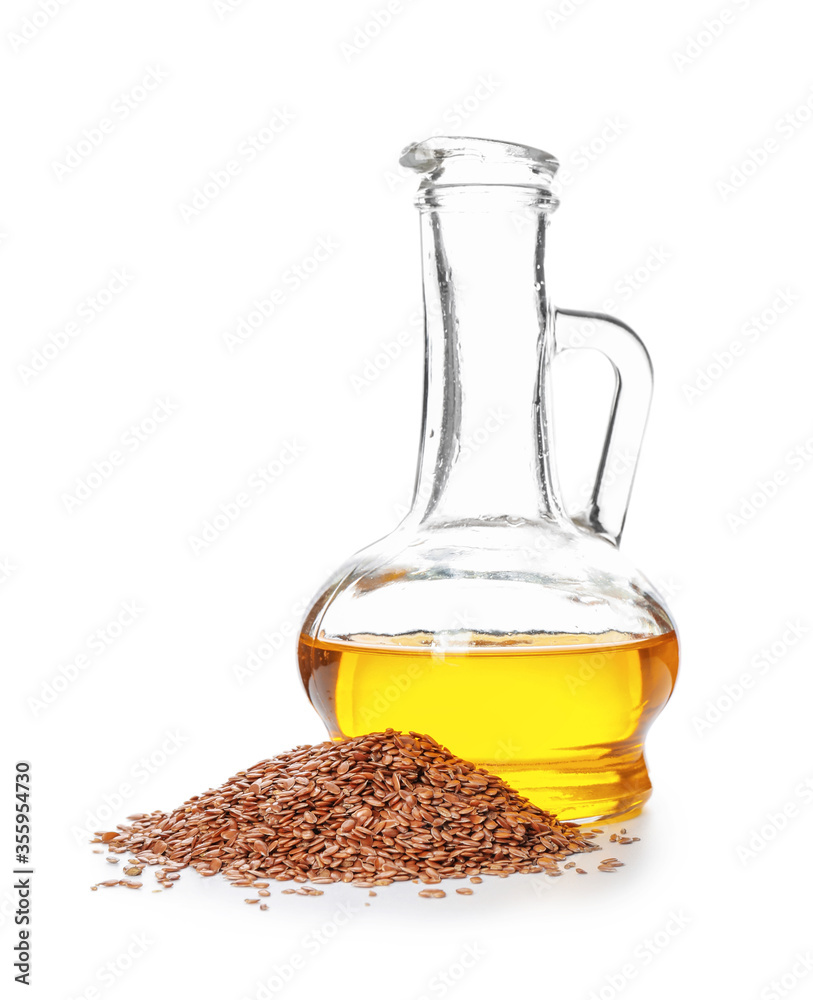 Jug of flax oil on white background