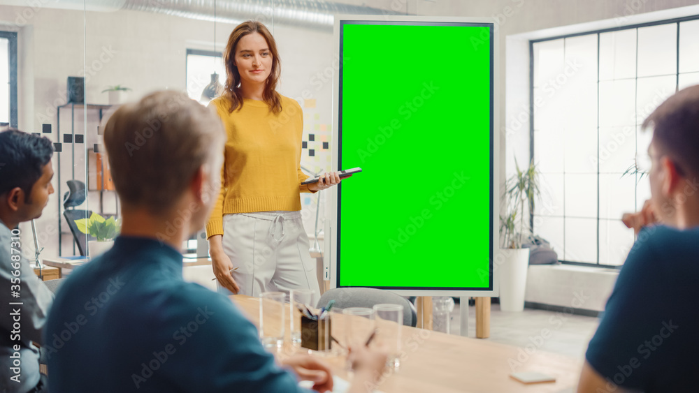 Female Project Manager Holds Meeting Presentation for a Team of Developers. She Shows Green Screen I