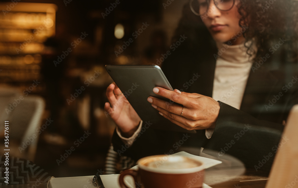 Businesswoman using cafe wifi