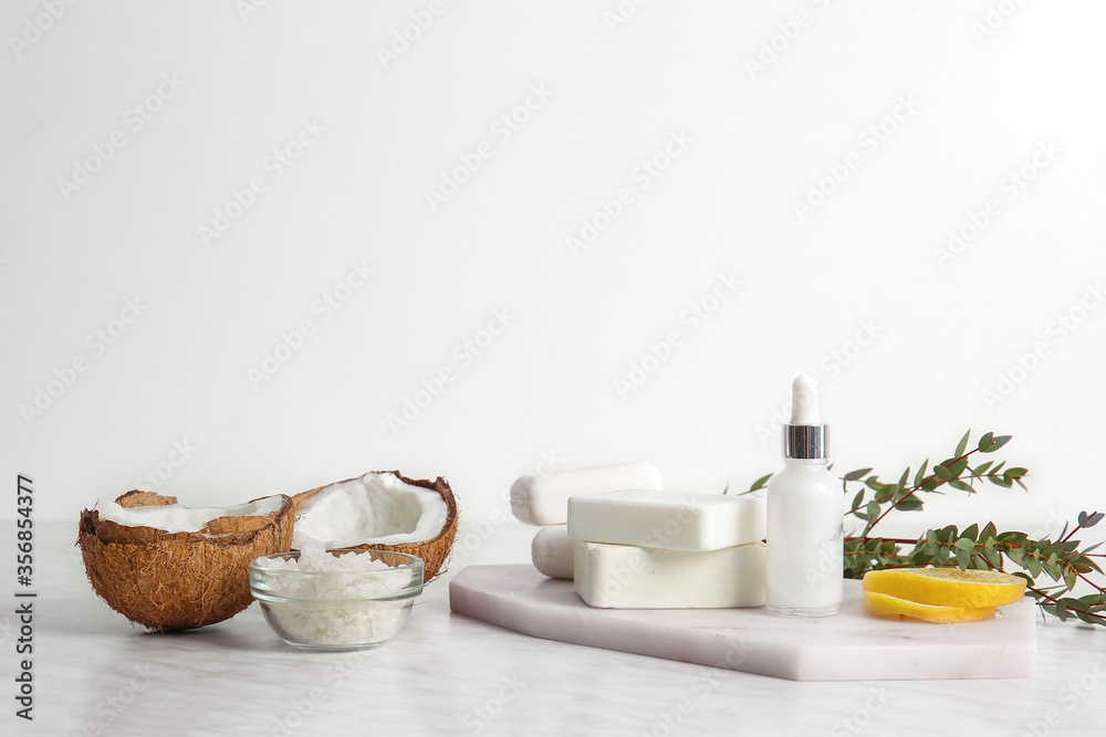 Natural cosmetics with ingredients on table