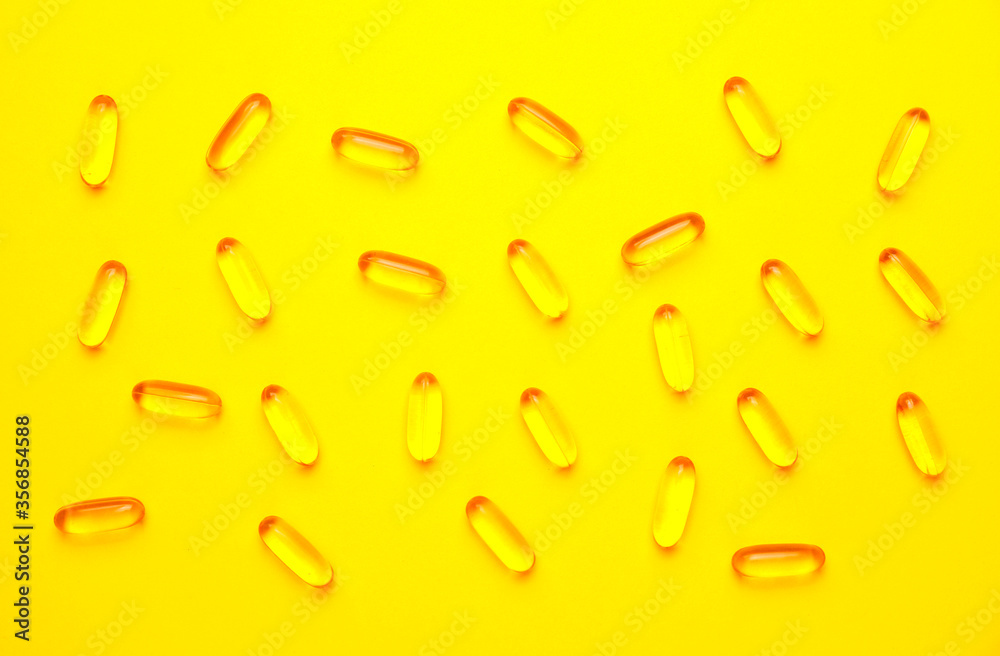 Fish oil capsules on color background