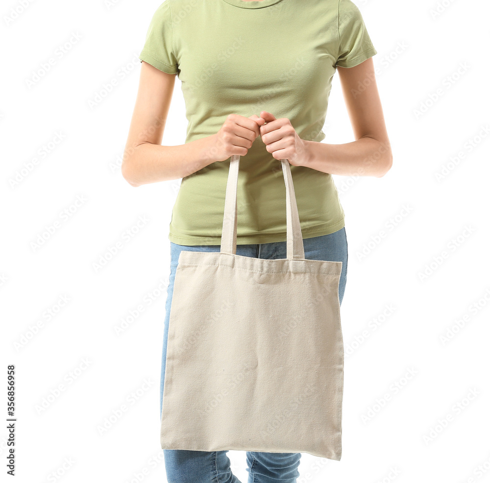 Young woman with eco bag on white background