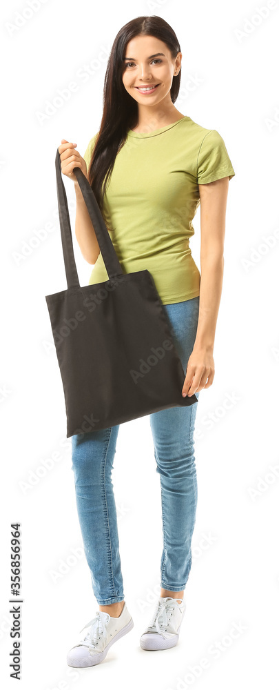 Young woman with eco bag on white background