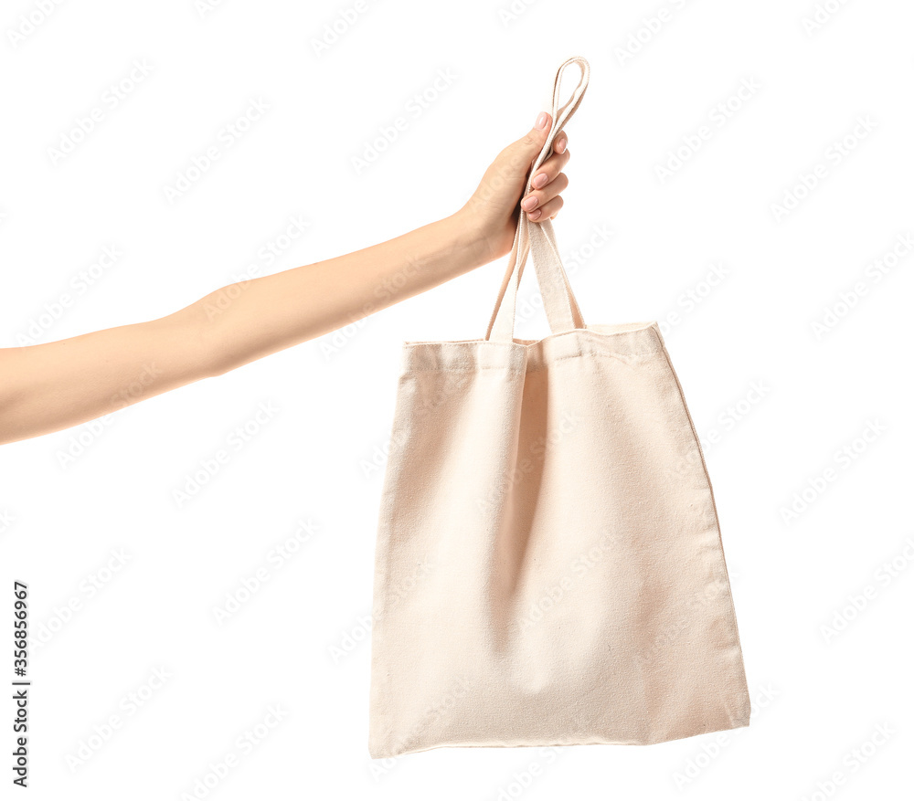 Female hand with eco bag on white background