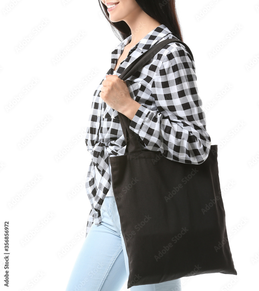 Young woman with eco bag on white background