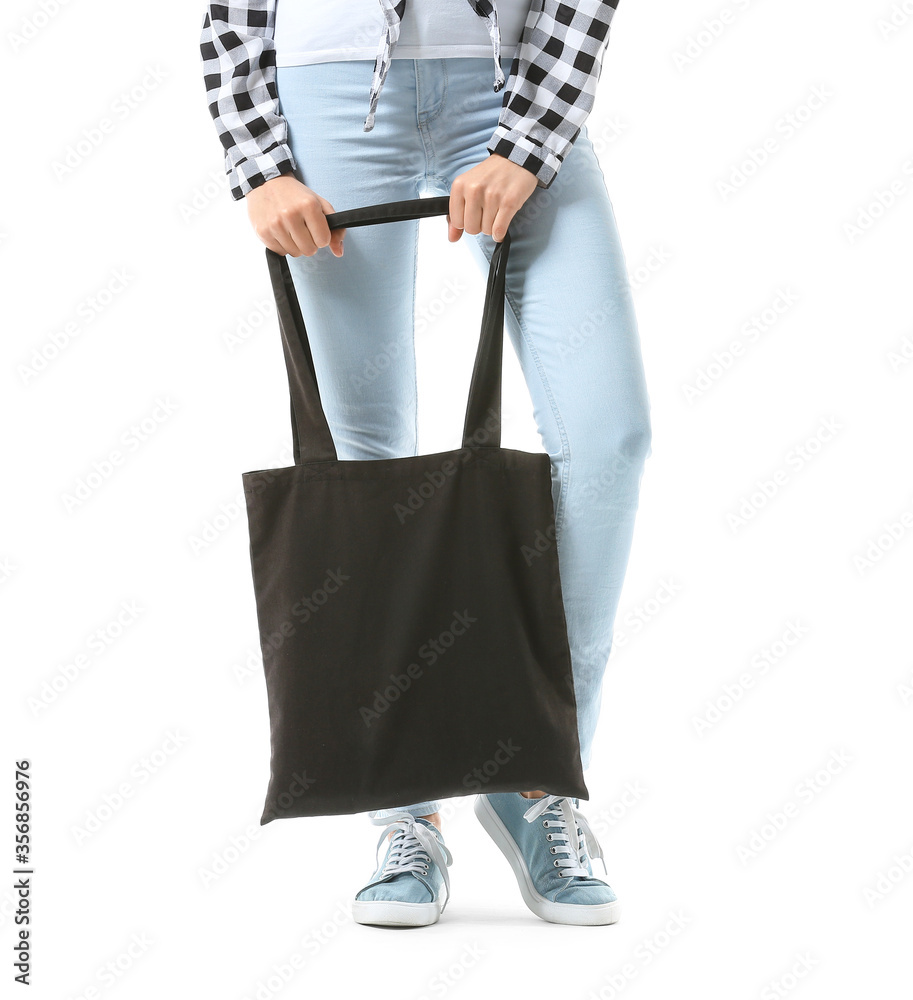 Young woman with eco bag on white background