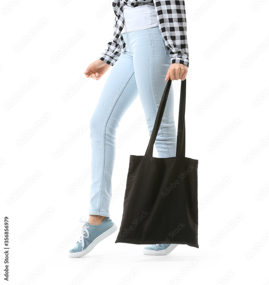 Young woman with eco bag on white background