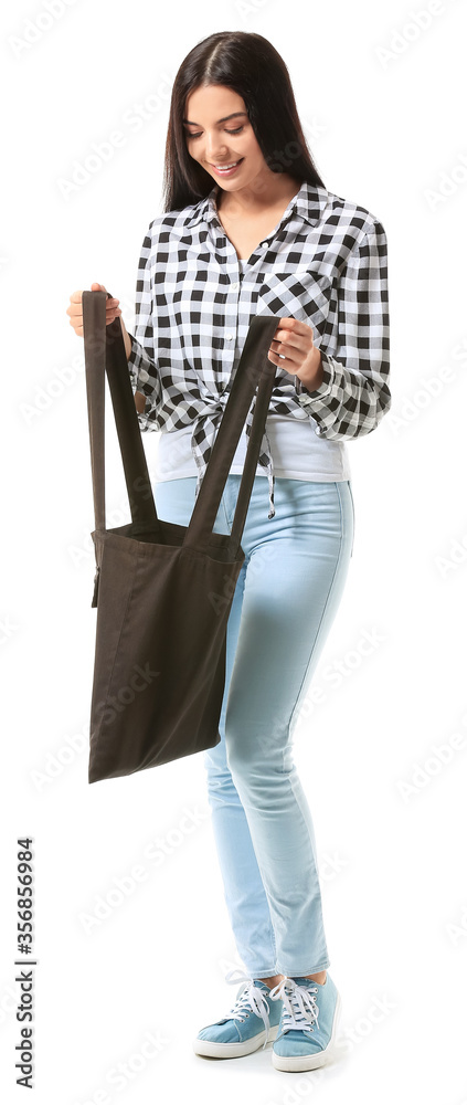 Young woman with eco bag on white background