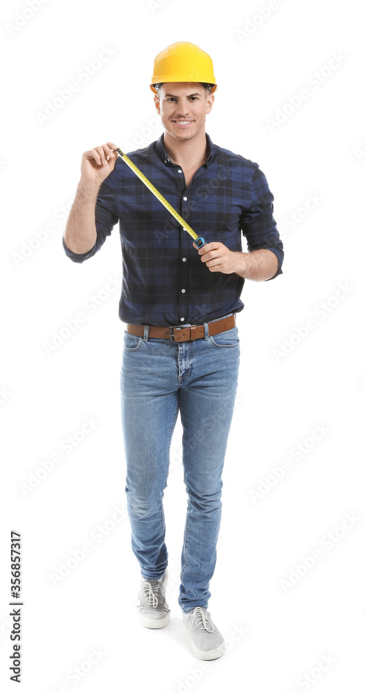 Young man with measuring tape on white background