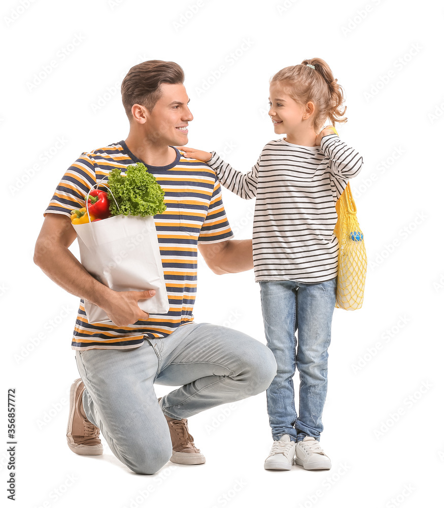 Father and daughter with food in bags on white background