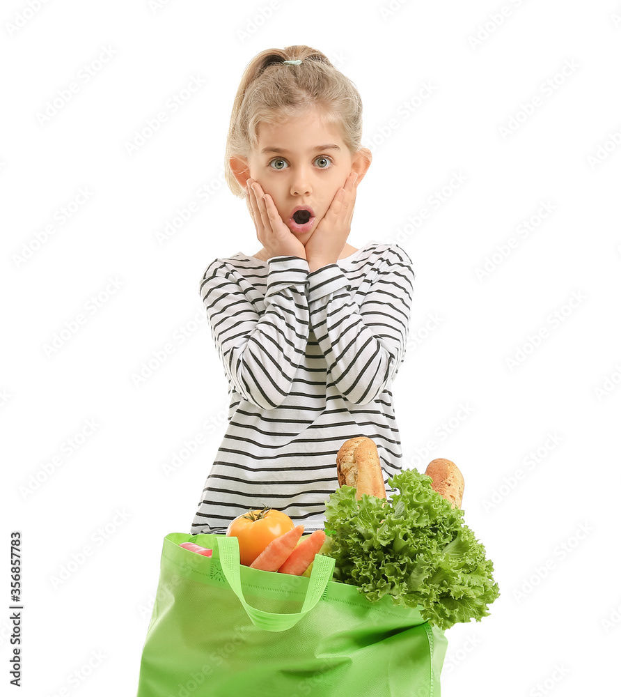 Surprised little girl with food in bag on white background