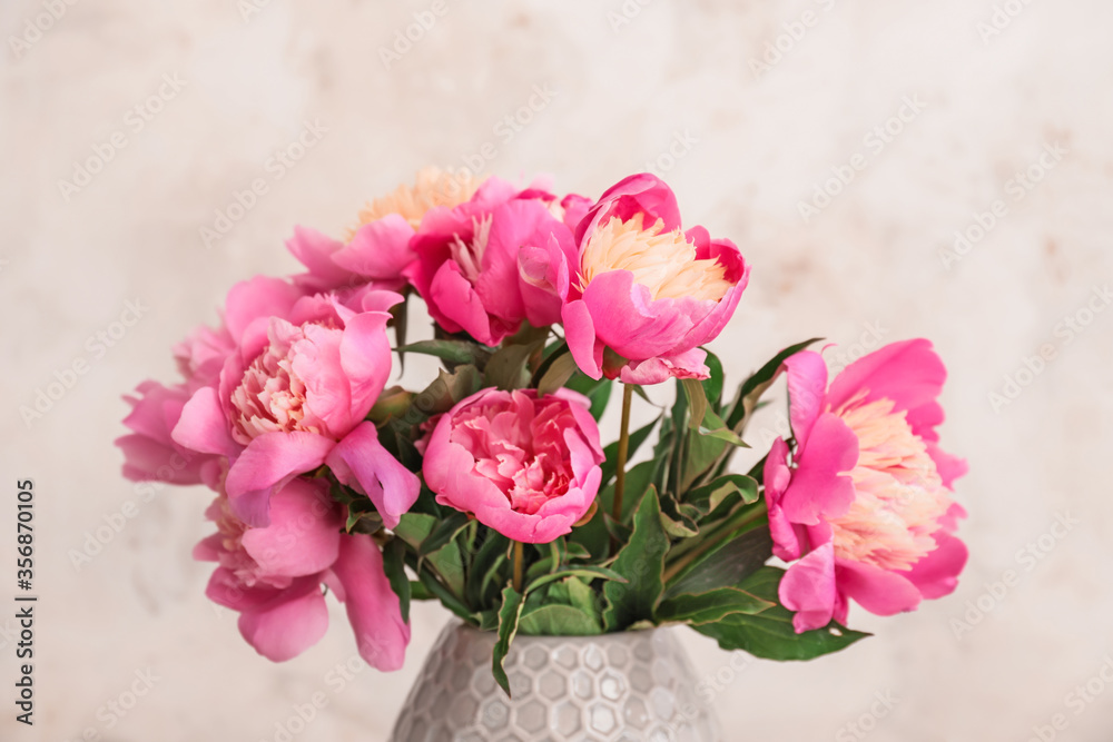 Bouquet of beautiful peony flowers on light background