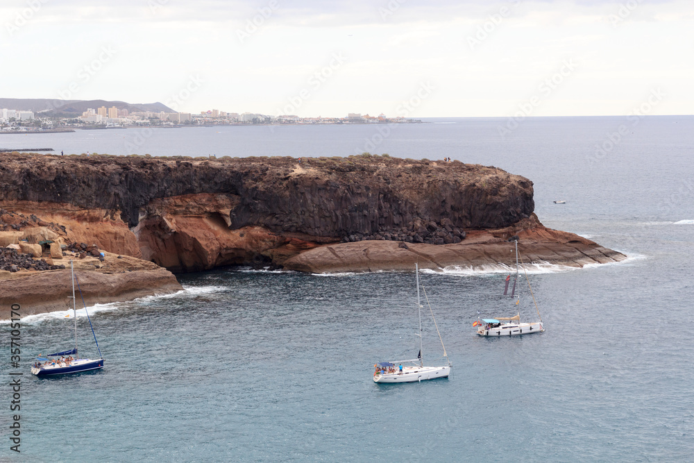 Coastline with cliffs and Atlantic Ocean near beach Playa de los Morteros on Canary Island Tenerife,