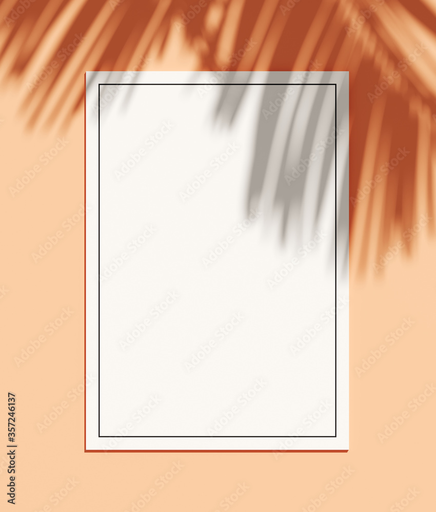 Minimal nature background for summer concept. White paper and palm leaf shadow on coral background. 