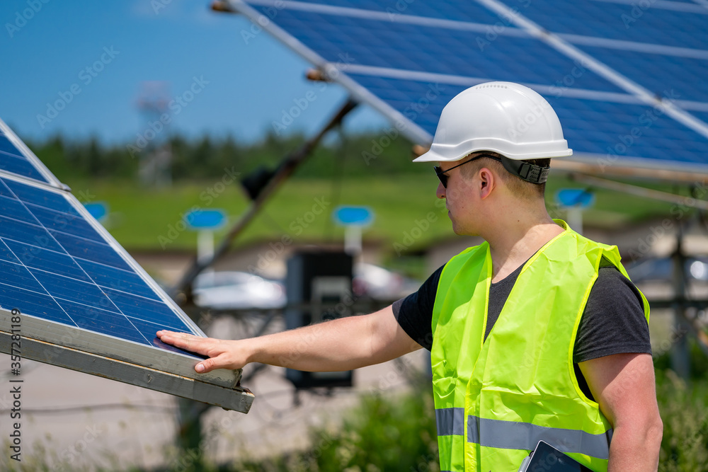 The concept of green new energy. Engeneer at solar plant.