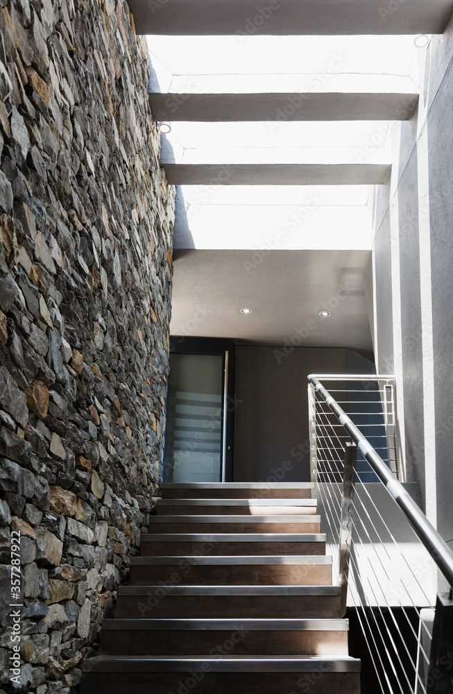 Stairs and stone wall in modern house