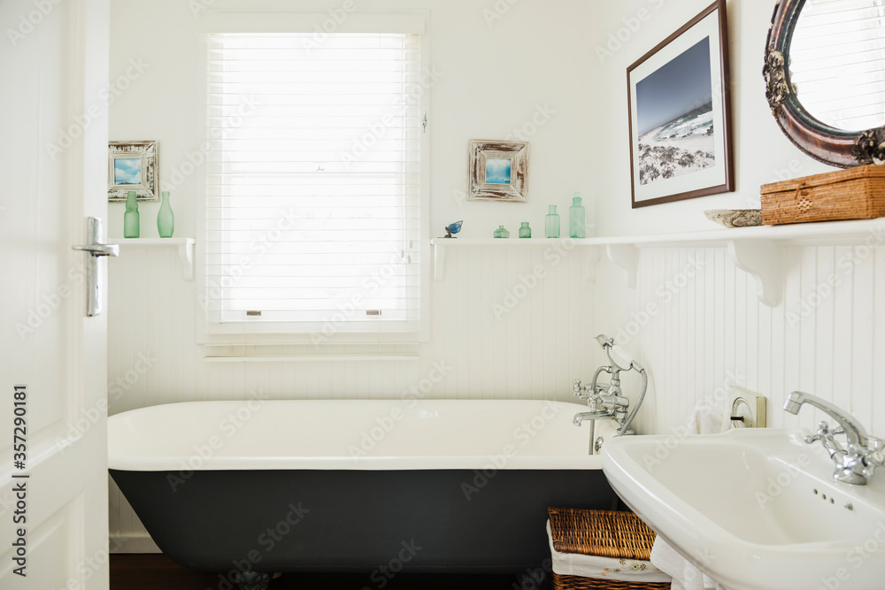 Claw foot bathtub in ornate bathroom