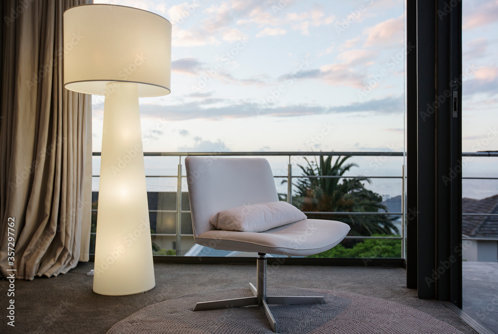 Modern floor lamp and chair in living room corner