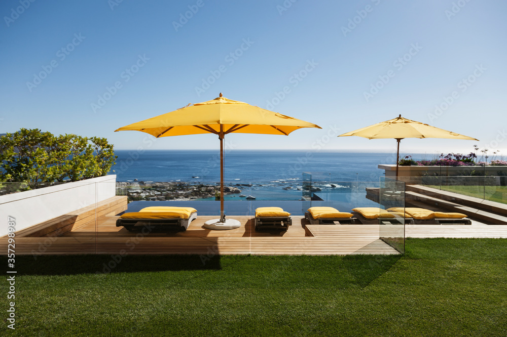 Lounge chairs overlooking infinity pool and ocean