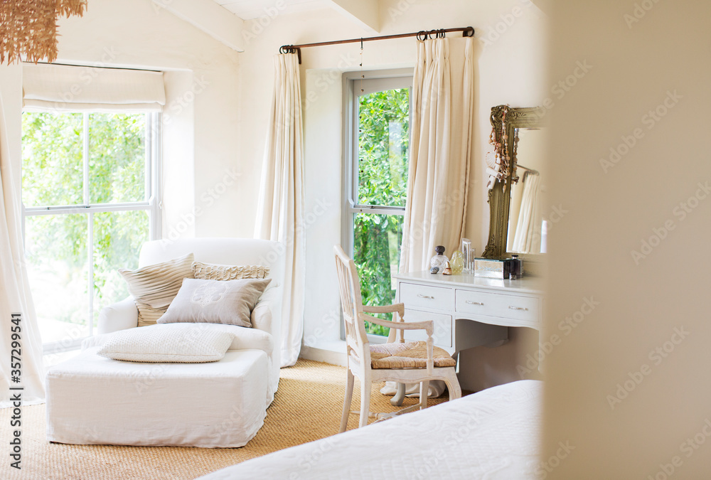 Armchair and vanity in rustic bedroom