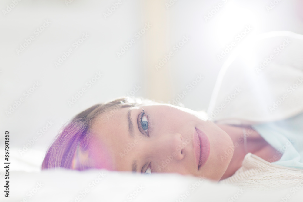 Close up of woman laying on bed