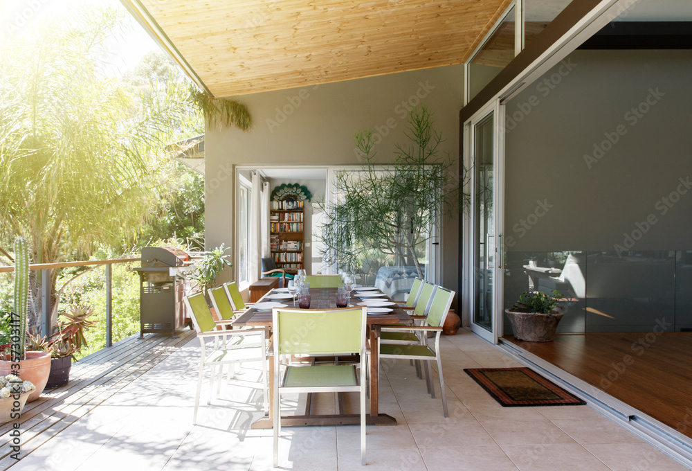 Dining table and chairs in sunny patio