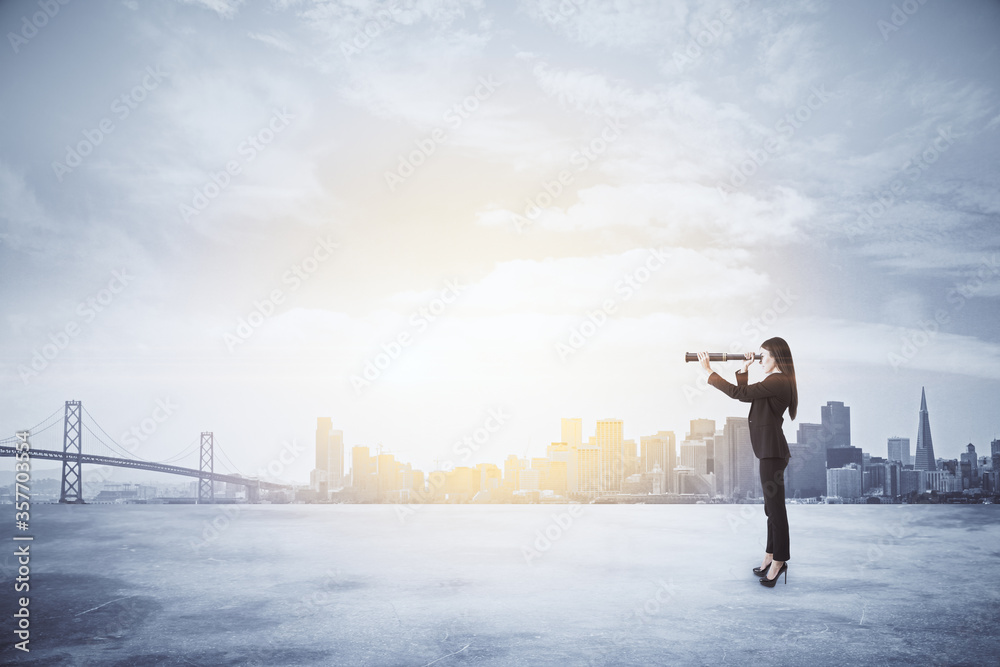 Side view of thoughtful young businesswoman using binoculars