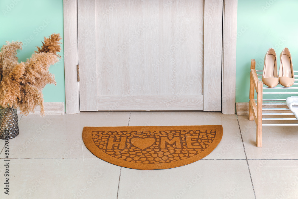 Interior of modern stylish hallway with door mat