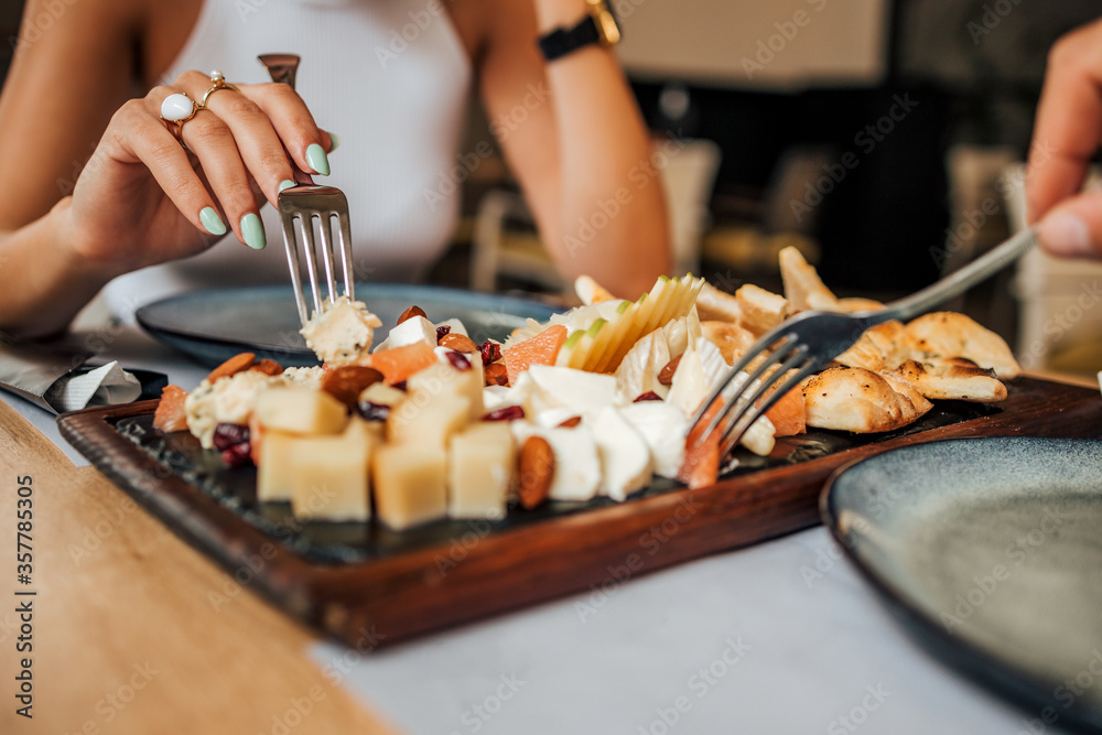 Eating healthy meal with friends, close-up.