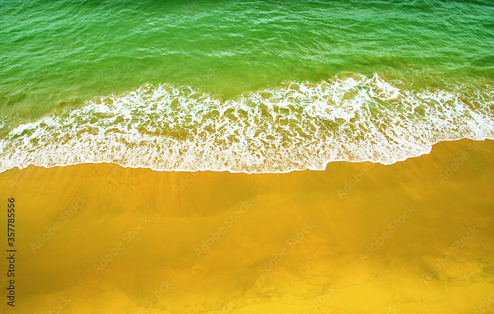 Wave of blue ocean on  beach.