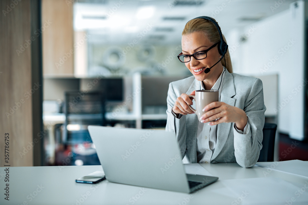 Portrait of a smiling businesswoman having online video call.