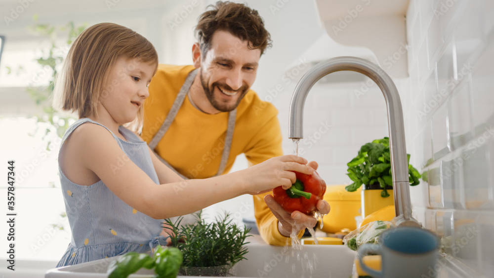 In Kitchen: Father and Little Daughter Cooking Together Healthy Dinner. Dad Teaches Little Girl Impo