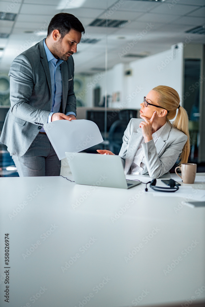 Business people discussing. Man complaining to a female executive.