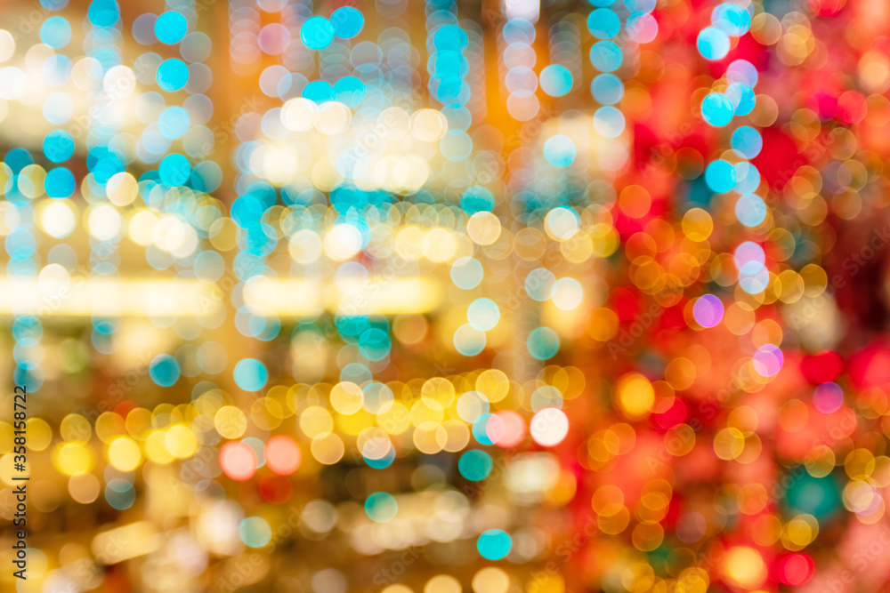 Vivid, beautiful out of focus shopping mall lights and falling confetti background