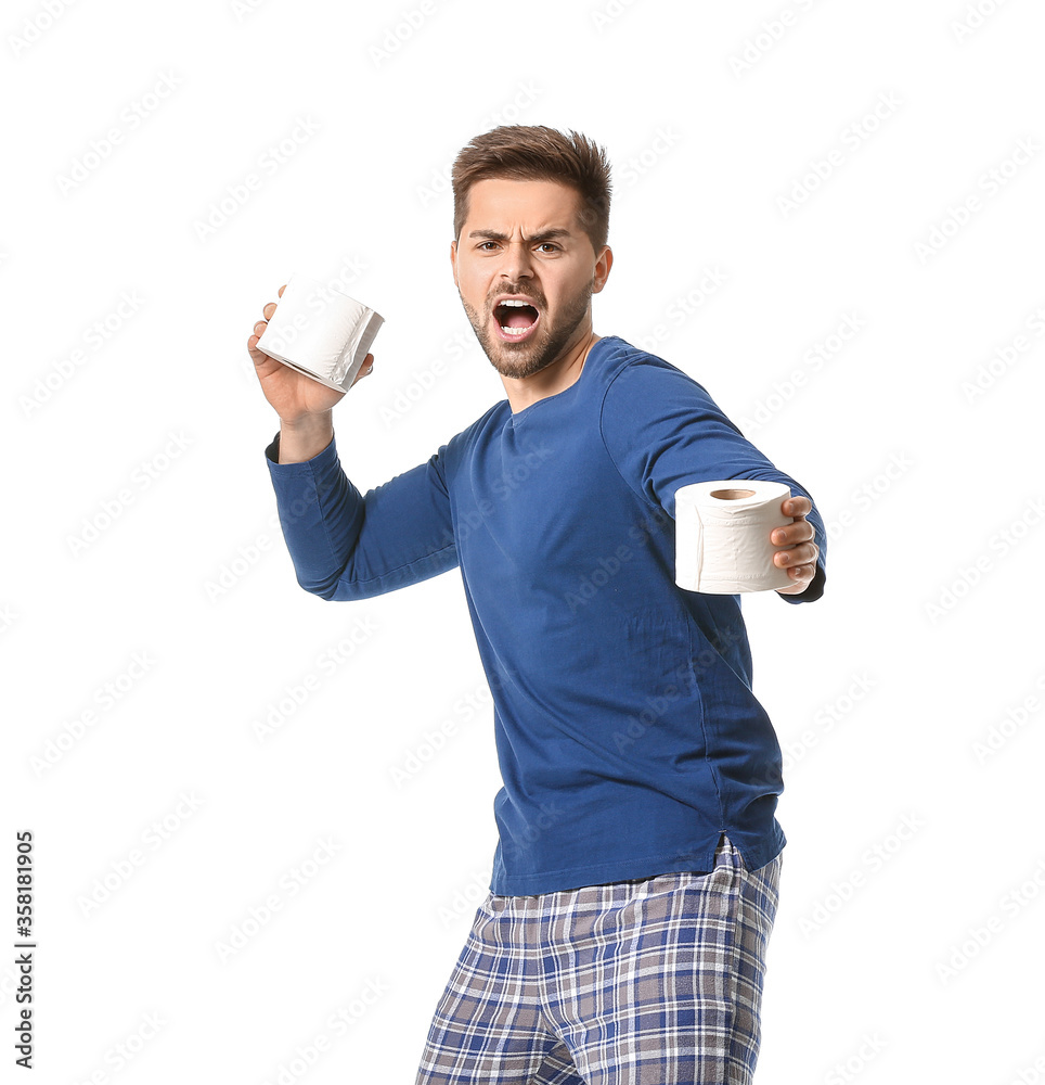 Funny young man with toilet paper on white background