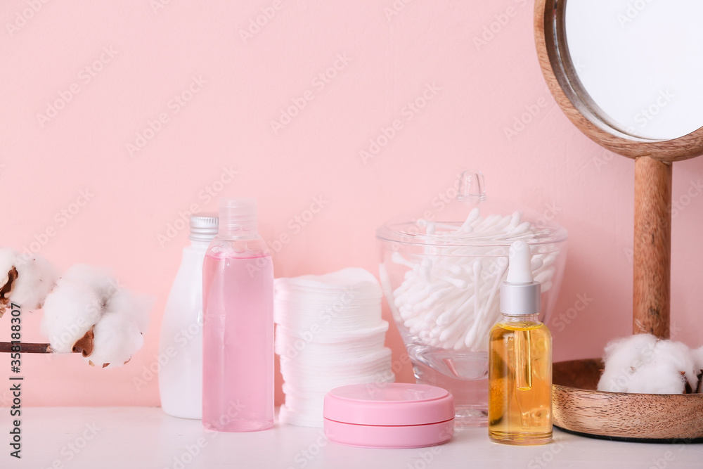 Cosmetics and supplies on table in bathroom