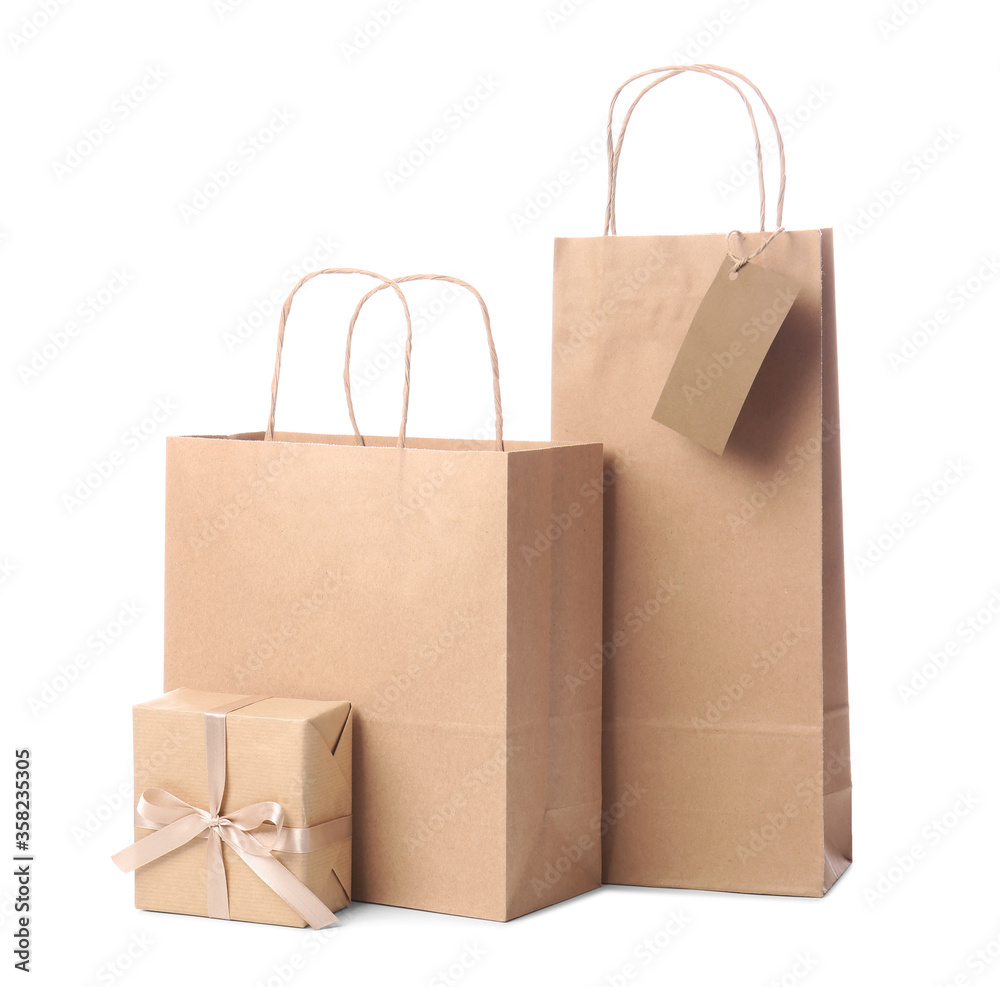 Paper shopping bags on white background