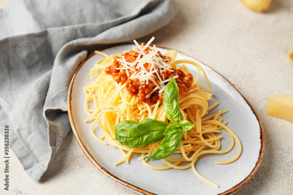 Plate with tasty pasta bolognese on table