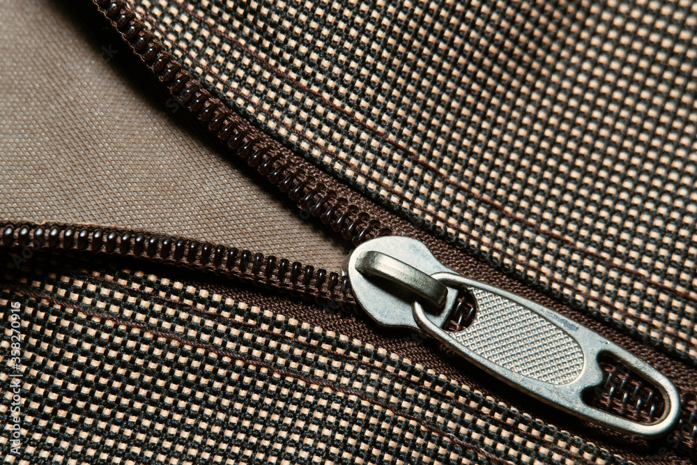 Close Up or macro shot of zipper on fabric clothing.