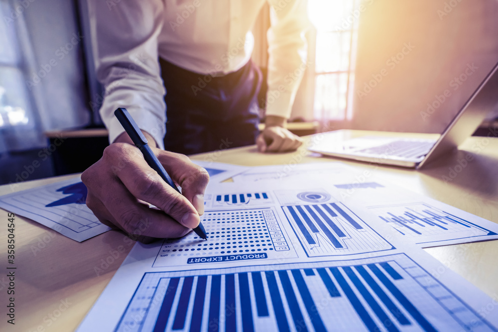 Businessman analyze data of stock market research.