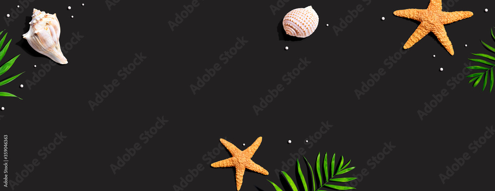 Summer concept with starfish and seashells overhead view - flat lay