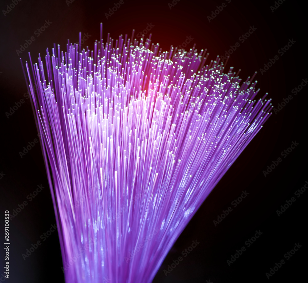 Fiber optics network cable on technology background