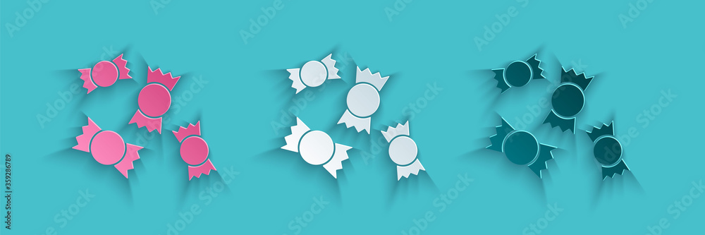 Paper cut Candy icon isolated on blue background. Paper art style. Vector Illustration