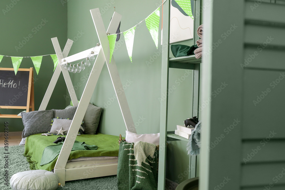 Interior of modern childrens room with comfortable bed