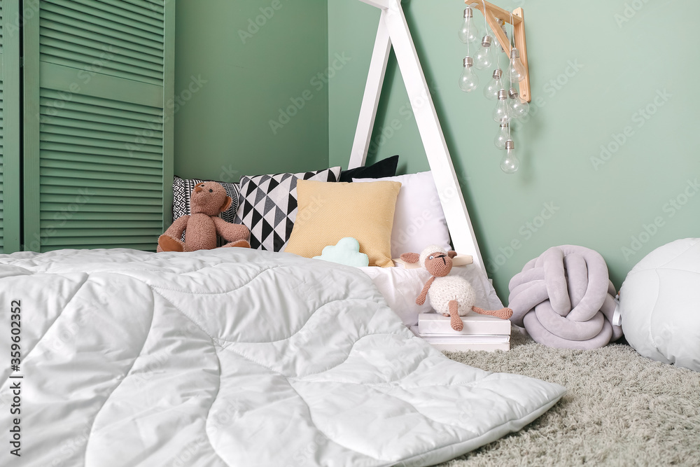 Interior of modern childrens room with comfortable bed