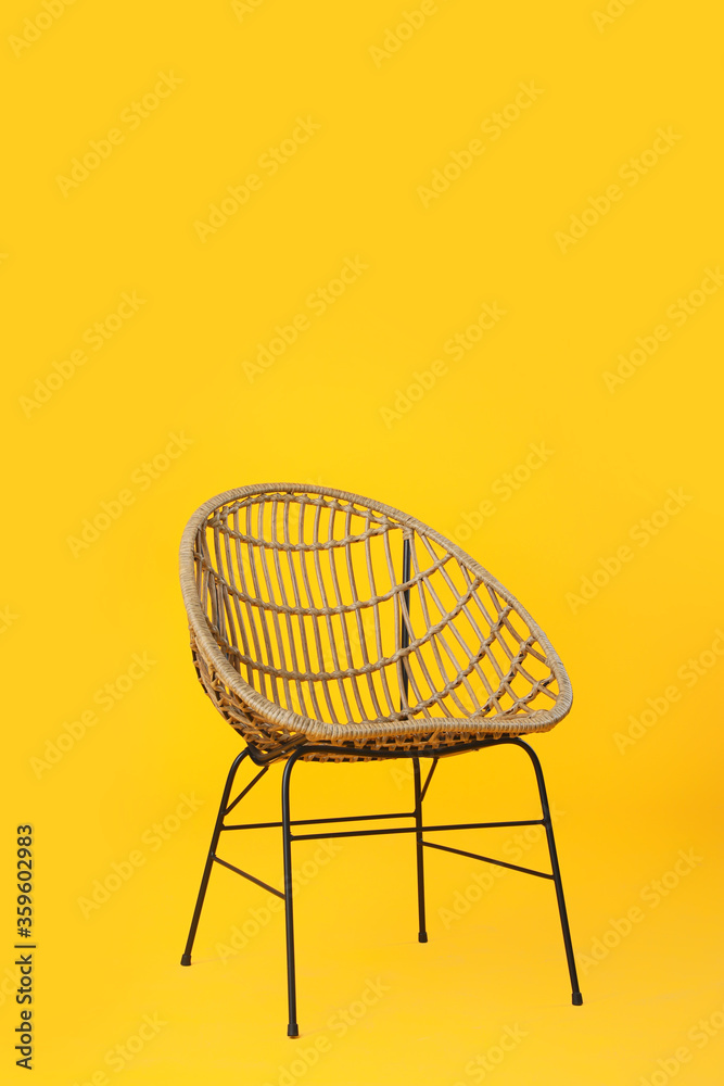 Stylish chair on color background