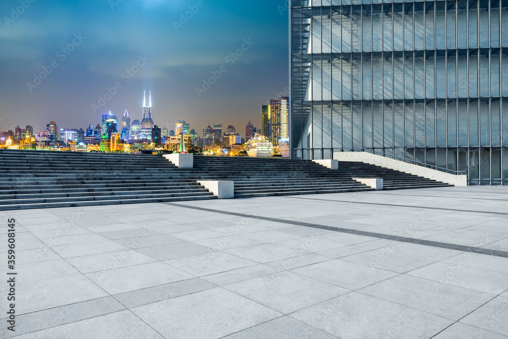 Empty square floor and modern city scenery at night in Shanghai,China.